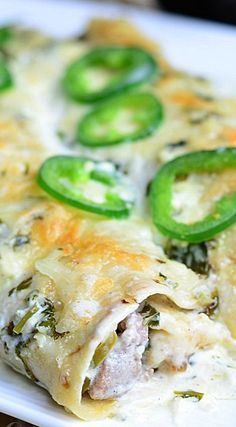 a close up of a plate of food with broccoli and cheese on it