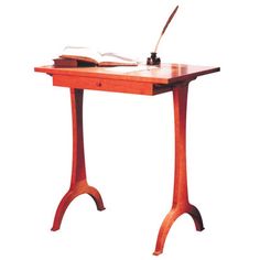 a wooden desk with a book on it