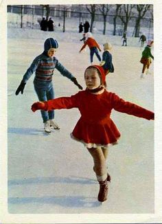 children are skating on an ice rink in the winter