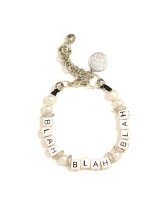 Make a statement with our BLAH BLAH BLAH Bracelet! Crafted with freshwater pearls, ceramic charms, and glittering pave rhinestones, this piece will have you standing out for all the right reasons. Get ready to be the talk of the town! 6" Freshwater pearl bracelet 1.5" extension Silver plated brass hardware Ceramic charms Pave rhinestones Handmade in New York City and Puerto Rico. Due to the handmade nature of our products, some charms may vary in color and style or be replaced if unavailable. Pl Hair Rings, Freshwater Pearl Bracelet, Brass Hardware, Men Necklace, Ring Bracelet, Pearl Bracelet, Bracelet Set, Fresh Water, Necklaces Bracelets