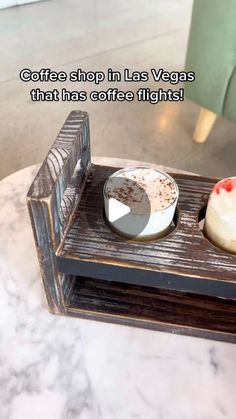 there is a small tray with two desserts on it and the caption reads coffee shop in las vegas that has coffee flights