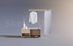 a white shirt hanging on a clothes rack next to a wooden cabinet with a mirror