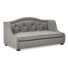 a gray couch sitting on top of a white floor