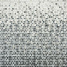 a black and white photo of a wall made up of small squares in grey tones