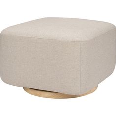 a beige ottoman sitting on top of a wooden stand