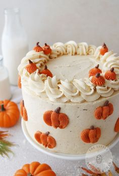 a cake with frosting and pumpkins on it