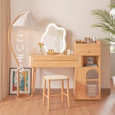 a wooden desk with a mirror and stool in front of it on a hard wood floor