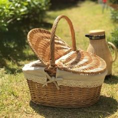 two wicker baskets sitting in the grass