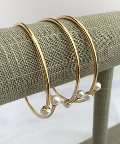 "14k Gold Filled White Crystal Pearl Bangle Sku#40115607LW6 7\" w/6mm Crystal Pearl Price per piece(1) For bulk wholesale prices with business license, please contact us 808-538-1410 Made in USA We ship from Hawaii by First Class  Airmail 1-3 days after receiving your order. Shipping to the USA Mainland usually takes 3 to 5 days. All our pearls and product pictures are taken in bright light. We try and give you the best representation of what the pearls look like in person. Please note that colors may vary due to viewing on different computers, phones and other devices. None of these pearls have been treated.  We buy directly from pearl farmers and auctions in Tahiti and Burma more than five times a year to give our clients the best selection possible.  We carry Golden South Sea pearls and Pearl Bangles Gold, Tahitian Pearl Bracelet, Business License, Edison Pearls, Golden South Sea Pearls, Pearl Bangle, Mabe Pearl, Pearl Cream, South Sea Pearls