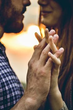 a man and woman holding each other's hands