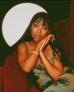 A photo of 90s singer Brandy photographed by Harry Langdon Brandy is wearing braids in a red velvet chair in a soft film like a photo. Busta Rhymes 90s, Cinema Photoshoot, Water Goddess, Goddess Aesthetic, Busta Rhymes, Tyra Banks, Women Photography