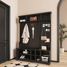 an entryway with a coat rack, mirror and rug