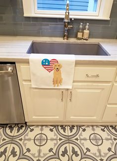 a kitchen with a sink, dishwasher and counter top in it's center