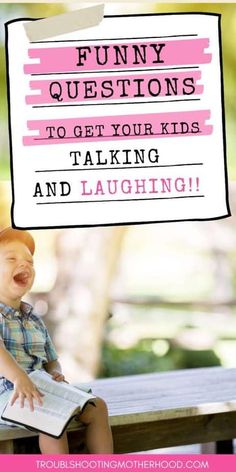 a little boy sitting on top of a wooden table next to a pink sign that says funny questions to get your kids talking and laughing