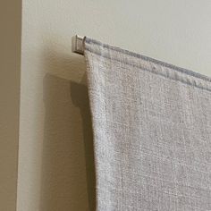 a curtain hanging on the side of a wall