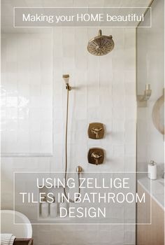 a bathroom with white tile and gold fixtures on the shower head is featured in this article