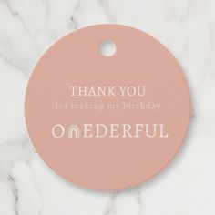 a pink thank you for making my birthday onederful ornament on a marble background