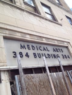 a sign on the side of a building that says medical arts 384 building