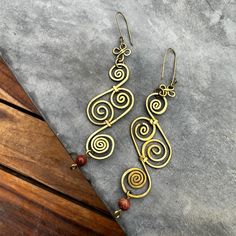 Brand New Handmade Earrings From Colombia. This Style Is Great For All Day Wearing Because It Is So Light! *The Spiral Represents The Journey That All Human Life Involves In The Evolution Of One's Consciousness. It Can Be Understood As The Path That Leads Through The Labyrinth To The Unity Or Self (Who One Truly Is) Located At Its Center.* Handmade Metal Swirl Earrings, Handmade Swirl Metal Earrings, Handmade Bohemian Swirl Earrings, Adjustable Wire Wrapped Swirl Earrings, Adjustable Swirl Wire Wrapped Earrings, Adjustable Spiral Brass Earrings, Indie Gifts, Wire Spiral, Wire Jewelry Earrings