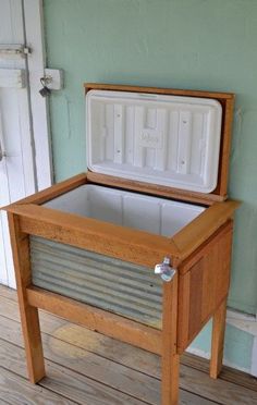 an ice chest sitting on top of a wooden floor