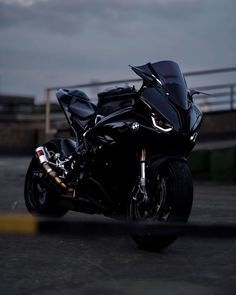 a black motorcycle is parked on the street