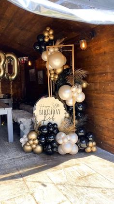 a birthday party with balloons and decorations in the shape of an 80's sign