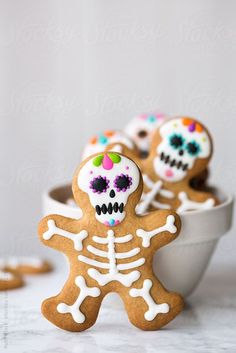 decorated sugar cookies in the shape of a skeleton and skull by julia for stocks on artfire