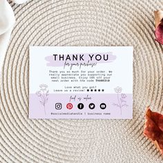 a thank card sitting on top of a white plate