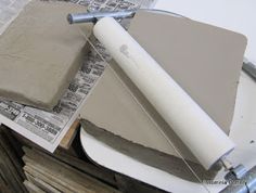 some construction materials are laying on top of newspapers and other items to be used in the project