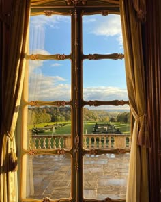 an open window looking out onto a park