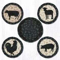 four black and white coasters with farm animals on them