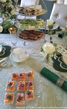 a table topped with plates and cups filled with food