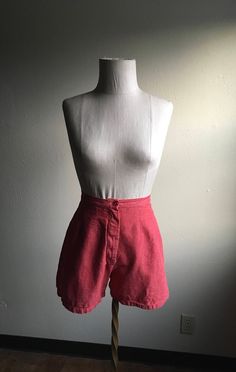 "1950s pre-shrunk cotton shorts soft red w/white undertone double seams down front zip fly, button top white stitching right back pocket worn in stencil/ink back right near hem measures, flat, waist-12 1/4\" rise-13 3/4\" inseam-3\" hem-11\" hip-20 1/2\"" Fitted Cotton Knee-length Jean Shorts, Fitted Knee-length Cotton Jean Shorts, Cotton High-waisted Shorts For Daywear, Retro Cotton Bottoms With Built-in Shorts, Red Pants With Built-in Shorts For Summer, Retro Short Bottoms For Summer, Fitted Cotton Bermuda Shorts For Spring, Retro Knee-length Shorts For Summer, Fitted High Waist Bermuda Shorts For Summer