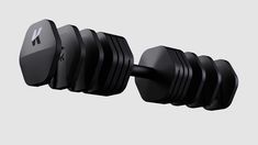 an image of dumbbells on the wall in front of a gray back ground