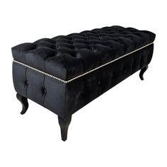 a black velvet bench with silver trimmings