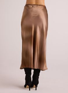 Introducing the Nora Midi Bias Skirt, featuring a stunning gradient print that is both creative and eye-catching. The bias cut adds a touch of elegance to the design, making it a must-have for any fashion-forward individual. Elevate your wardrobe with this unique and stylish piece. 55% Rayon 45% Viscose Elegant Gold Maxi Skirt For Evening, Elegant Gold Maxi Skirt For Summer, Gold Satin Party Skirt, Elegant Gold Mini Skirt, Chic Gold Lined Skirt Bottoms, Gold Chic Midi Skirt, Chic Gold Bottoms With Lined Skirt, Chic Gold Midi Skirt, Chic Gold Maxi Skirt