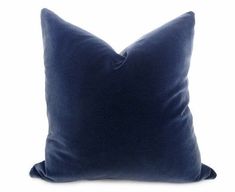 a blue pillow on a white background