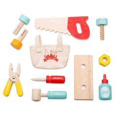 the contents of a play kitchen set including scissors, cutters, and other items