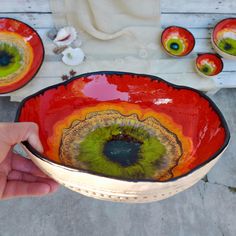 a person is holding a bowl with an eye on it