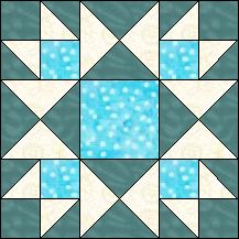 a blue and white quilt with an abstract design