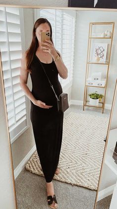 The perfect black maxi dress to dress up or down and to wear whether pregnant or not! This dress is also breastfeeding-friendly, making it ideal for wearing no matter what stage of motherhood you are in! A black tank maxi dress is one of the most versatile staples in a women's closet. Pair it with sneakers, strappy sandals, or heels; you can wear it for almost any event! Whenever I want a comfortable yet stylish look, this is my go-to. Black Dress Maternity, Dress Maternity, Maxi Tank Dress