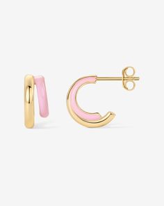 Dive into a world of trendy elegance with our colored enamel huggie earrings. These petite treasures seamlessly merge with any outfit, elevating your look whether it's a daytime casual or evening sophistication. With their compact design, they're as comfortable as they are chic.Materials: 14K yellow or white gold plated. 925 sterling silver posts. Blue, Pink, Purple or White Enamel. Measurements: Outer Diameters: 13mm, and 10.5mm. Width: 6.5mm; Thickness: 2.4mm. Gold Charm Earrings, Earrings Preppy, Light Pink Earrings, Evry Jewels Earrings, Good Earrings, Trendy Jewelry 2024, Gold Hoops Earrings, Preppy Accessories, Double Earrings