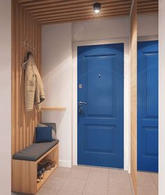 a blue door and bench in a room