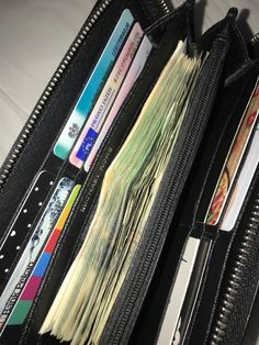 an open wallet with several credit cards in it