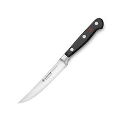 a black and white knife with red dots on the blade is shown in front of a white background