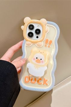 a person holding up a phone case with an animal on it