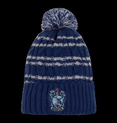 a blue and white striped knitted hat with a hog potter crest on the front