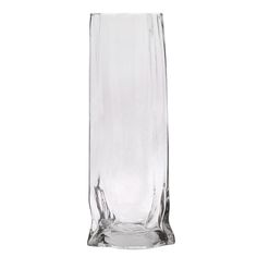 a tall glass vase sitting on top of a table