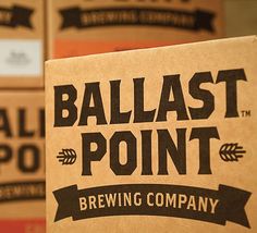 several boxes are stacked on top of each other with the words ballast point brewing company printed on them