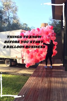 a woman holding balloons with the words things to know before you start a balloon business